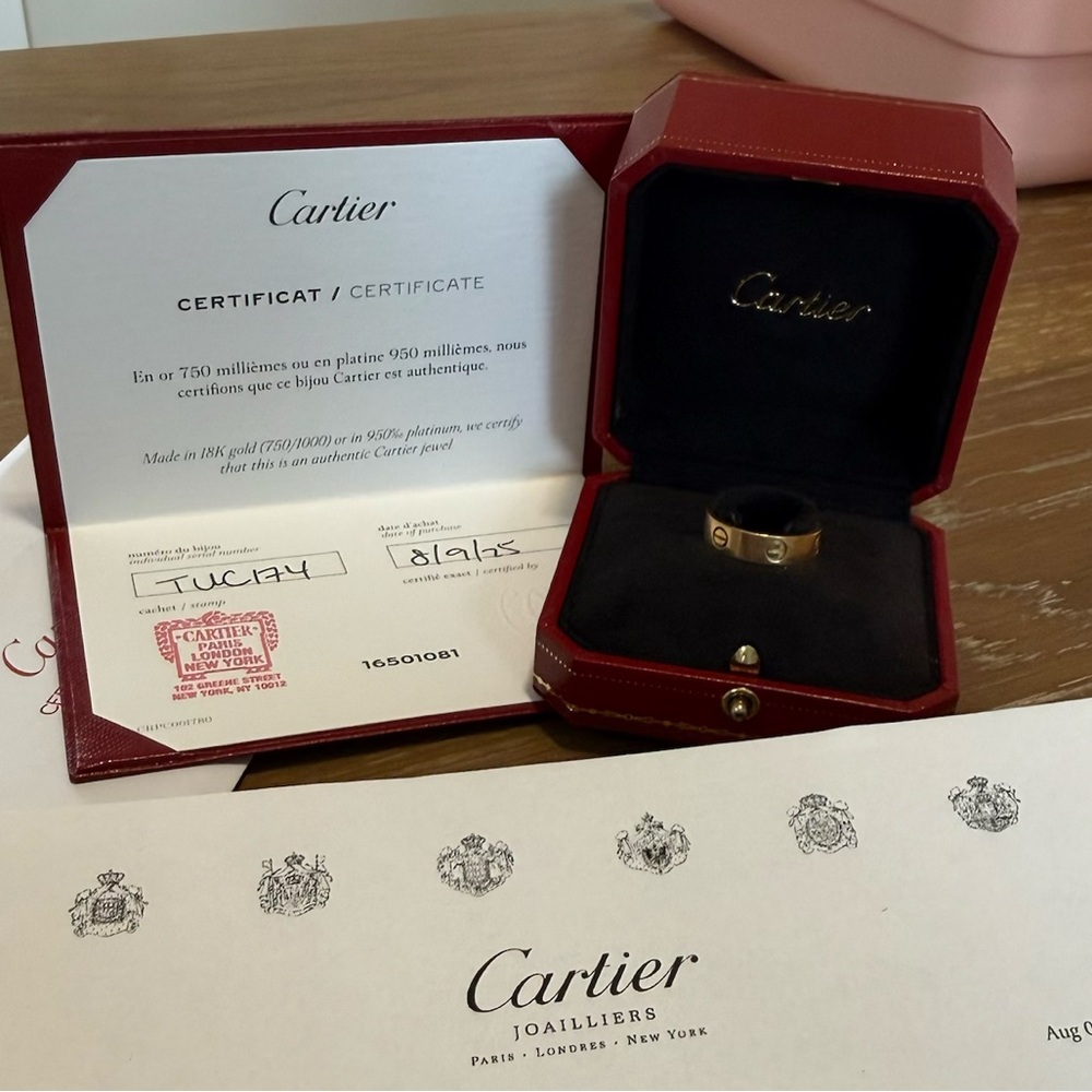 Cartier gold ring with red presentation box and paperwork